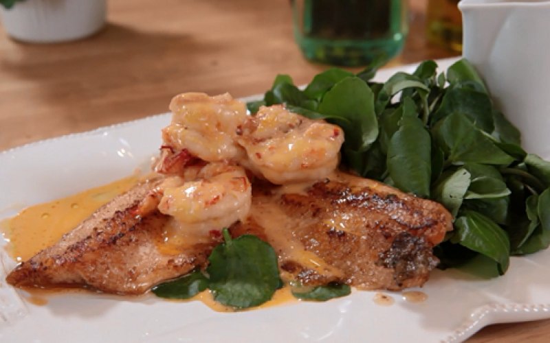 Rainbow trout with creamy prawn sauce and watercress
